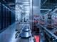 Data-centre servers, semiconductor manufacturing and industrial robots representing China’s AI technology industry.